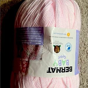 Pink and white wool couture cheeky super chunky crochet yarn with needle.
